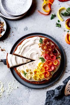 a cake with white frosting and colorful toppings