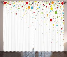 the curtain is decorated with multicolored dots