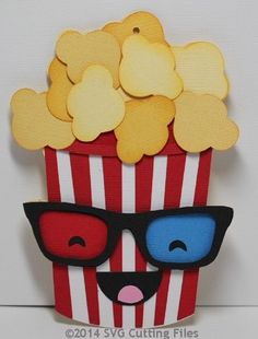 a red and white striped cup with some yellow hearts on it's head wearing sunglasses