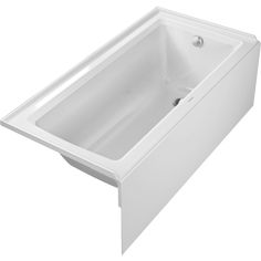 a white bath tub sitting on top of a white counter next to a toilet paper dispenser