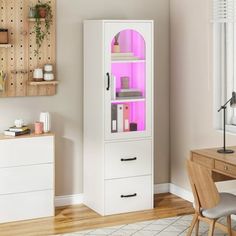 a room with a desk, chair and cabinet that has pink lights on the doors