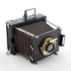 an old fashioned camera on a white background