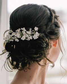 a woman with flowers in her hair