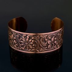 Solid COPPER Cuff Bracelet with Embossed Floral Design. Adjustable with Baked on Lacquer for Long Lasting Wear Width: 1 inch Length: 6.25 inches - adjustable Design: Embossed Floral Stunning detail on these beautiful embossed cuffs. These are very sturdy but adjustable The tooling dates back to the 1940s and cannot be duplicated in today's market. Stamped 'solid copper' on the inside. Etched Copper, Copper Cuff Bracelet, Floral Bracelet, Copper Cuff, Copper Bracelet, Copper Jewelry, Antique Copper, Emboss, Cuff Bracelet