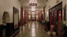 an empty hallway with balloons and decorations on the floor