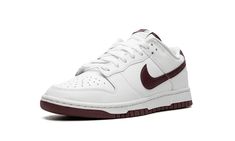 The Nike Dunk Low “White/Night Maroon” is a colorway of the legacy sneaker with clean, two-tone color scheme.  The upper has a predominantly white leather construction with a Night Maroon leather Swoosh logo on both sides.  More Night Maroon accenting can be found on the “Nike” embroidery on the heel and the “Nike” and Swoosh logos on the tongue.  Underfoot, the shoe’s white midsole and maroon outsole put the finishing touch on the design.  Release date: March 25, 2023 Maroon Nike, Maroon Shoes, Maroon Leather, Nike Dunk Low, Y2k Style, Dunk Low, Adidas Samba, Nike Dunks, Kids Gifts