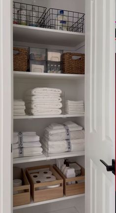 the closet is full of folded towels and other things to use as storage for linens