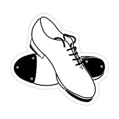 a pair of shoes sticker sitting on top of a white surface next to each other