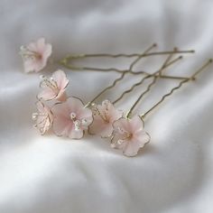 Gorgeous small blush (rose poudrés) flowers for you bridal hair style. Cherry blossoms are some of the most symbolically significant flowers in the world. Also known as sakura, cherry blossoms are rich in meaning and cultural significance. The main feature of cherry blossoms is the breathtaking pink or white blooms. These bridal hair pins with rose Sakura flowers will make your look romantic and fresh.  Details: HANDMADE IN FRANCE ♥ Flowers are handcrafted, they stay flexible and resistant. Tarn Pink Hair Pins, France Flowers, Sakura Hair, Japanese Hair Care, Wire Brooch, Stay Flexible, Boho Hair Pins, Pink Hair Accessories, Bridal Hair Pin