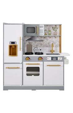 a toy kitchen with white cabinets and gold trimmings on the doors, oven, microwave and sink