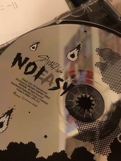 there is a cd that has been placed on top of a table with the word notas printed on it