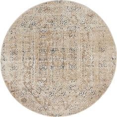 a round rug with an intricate design in beige and blue tones on a white background