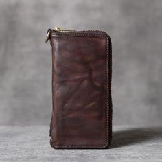 Genuine Leather: Our wallet is made from premium leather, which is equally luxurious as it is long-lasting. Over time your wallet will soften, mold perfectly to your pocket, build character as it ages.   
Hand-rubbed color process creates a unique vintage old effect.This vintage style men's wallet has room for your money, bills, cards, photos etc. 
 
 
 ITEM DETAILS:  
 
 Item Size: 9cm x 18cm  
 Item Type: Long Wallet  
 Material: Genuine Leather  
 Color:   Coffee  
 
 
 
 Great gift ideas for Classic Brown Wallet With Zipper Pocket, Vintage Brown Wallet With Zipper, Vintage Brown Wallets With Zipper Closure, Vintage Brown Wallet With Zipper Closure, Brown Bifold Wallet With Zipper Pocket, Brown Leather Trifold Wallet With Zipper Closure, Classic Leather Wallet With Zipper Pocket, Vintage Wallets With Zipper Closure, Leather Wallets With Zipper For Everyday Use