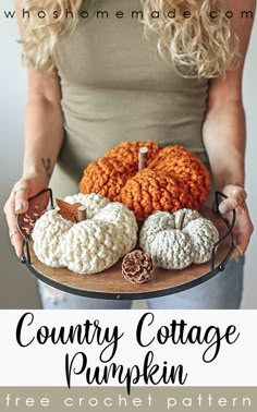 a woman holding a plate with crocheted pumpkins on it and the words country cottage pumpkin free crochet pattern