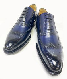 Burnished Calfskin Wingtip Oxford Navy Spectacular & Completely Handmade, this Hand Burnished Calfskin lace-up Wingtip Oxford from the Ugo Vasare collection features Goodyear Welted construction, Brogue Design with Decorative Perforations, soft Calfskin lining, cushioned insole, a stitched welt and a full Leather sole! Matching Belt Available. Don't See Your Size? Call us to arrange a Special Order. Fitted Blue Oxfords With Brogue Detailing, Semi-formal Blue Leather Shoes, Fitted Blue Leather Shoes For Semi-formal Occasions, Fitted Blue Leather Shoes With Goodyear Welt, Blue Fitted Leather Shoes With Goodyear Welted, Elegant Blue Lace-up Oxfords, Luxury Fitted Lace-up Dress Shoes, Navy Elegant Oxfords For Business, Elegant Navy Oxfords For Business