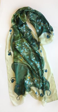 Green Silk Scarf hand painted. Mothers Day gift. Woman fashion wrap in green and aqua colours combo. Handpainted scarves. Art Deco shawl painted. Long Luxurious shawls. Unique handmade scarves. Silk painting, Evening shawl wrap. Garden Wedding accessory. Wedding accessory. Romantic wedding style. Botanical scarf. Olive green silk scarf with turquoise flowers painted in stylized composition. ♥This is a unique, hand painted silk scarf measuring 35 by 70 inches. Silk scarf painted on pure silk 6mm, Traditional Handmade Green Shawl, Green Silk Shawl Scarf, Handmade Green Shawl For Spring, Green Scarf As Spring Gift, Green Scarves For Spring Gift, Green Scarf For Spring Gift, Hand Painted Green Silk Scarf, Green Handmade Shawl As Gift, Handmade Green Shawl For Gift