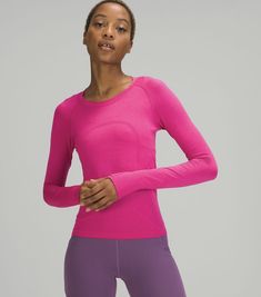 Pink Functional Activewear By Lululemon, Lululemon Technical Yoga Tops, Pink Functional Lululemon Activewear, Lululemon Long Sleeve Breathable Top, Pink Lululemon Activewear For Workout, Lululemon Pink Workout Activewear, Lululemon Technical Tops For Yoga, Pink Lululemon Athleisure Activewear, Lululemon Seamless Gym Tops