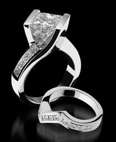 two white gold rings with diamonds on them