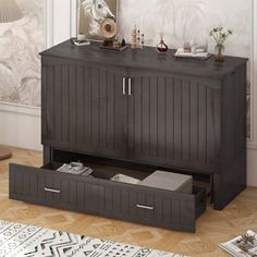 an entertainment center with drawers in a living room