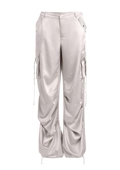 Loose-fitting utilitarian pants featuring side cargo pockets with metal zipper and anglet embellishments. Double back welt pockets, and an adjustable ruched gathered drawstring hem. Can be styled for a mid or low-rise feel. Shown here in Silver. 98% Polyester, 2% Elastane Made in China Model is 5'10" wearing size S Style No. 2760-14 Satin Cargo Pants, Light Blue Pants, Australia Clothes, Satin Trousers, Zipper Pants, Cargo Pant, Cargo Pants Women, Blue Pants, Metal Zipper