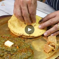 a person is making tortillas with pesto and cheese on a gold plate