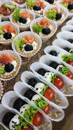 there are many different types of food on the table together, including salads and appetizers