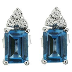 2.65 Carat Natural Topaz 14 Karat Solid White Gold Diamond Earrings Stamped: 14K Total Earrings Weight: 1.5 Grams Topaz Weight: 2.50 Carat (7.00x5.00 Millimeters) Quantity: 2 Diamond Weight: 0.15 Carat (F-G Color, VS2-SI1 Clarity ) Quantity: 6 Face Measures: 12.00x5.00 Millimeters SKU: [600346] White Gold Diamond Earrings, Gold Diamond Earrings, London Blue Topaz, London Blue, Rose Gold Diamonds, Diamond Bracelets, Natural Emerald, Diamond Sizes, Gold Earrings Studs