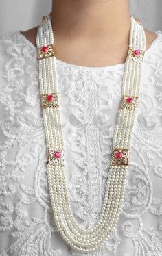 These Rani Haar Malas are Multi-layered strands of lustrous pearls intricately designed with gold detailing, perfect for weddings, festivals, and grand celebrations. Each piece is meticulously handcrafted by skilled artisans, ensuring superior quality and intricate designs. Our jewelry complements both traditional Indian and Pakistani attire and contemporary outfits, making it a versatile addition to your collection. 💖 Why Choose Us? *Authenticity: We use high-quality materials to ensure each p Pearl Pendant Necklace For Festivals, Festival Pearl Necklace With Pearl Pendant, Pearl Necklace With Pearl Pendant For Festivals, Pearl Necklace For Festivals And Gifts, Festive Pearl Necklace With Pearl Chain, Multi-strand Pearl Necklace For Wedding, Elegant White Pearl Necklace For Ceremonial Occasions, Elegant Pearl Necklace For Party And Festivals, Multi-strand Pearl Pendant Necklace For Wedding