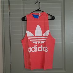 Adidas Originals Tee Condition: New Color: Neon Pink Size: M/ L No Holds/ Trades Adidas Sporty Cotton Tank Top, Adidas Cotton Tank Top For Spring, Adidas Casual Cotton Tank Top, Adidas Casual Tank Top For Sports, Adidas Casual Summer Tank Top, Casual Adidas Cotton Tank Top, Casual Adidas Summer Tank Top, Adidas Summer Sleeveless Tops, Adidas Sporty Summer Tank Top