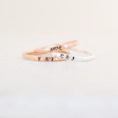 Our pebbled 1.63 mm band is hand formed, soldered, hammered and stamped with your tiny initial. Wear one, or stack them for all your loves. ♥ This listing is for one ring; add multiple quantities to your cart for more. This ring is substantial standing alone, yet minimalist enough to stack several.{DETAILS}:* 1.63 mm band (2 mm where letters sit)* 1.5 mm uppercase letters* your choice of sterling silver, 14k gold fill, rose gold fill or SOLID 14k yellow or rose gold►Lots more stacking rings for. Best Friends Graduation, Stackable Name Rings, Friends Graduation, Couples Ring, Letter Ring, Personalized Ring, Baby Jewelry, Boyfriend Goals, Initial Ring