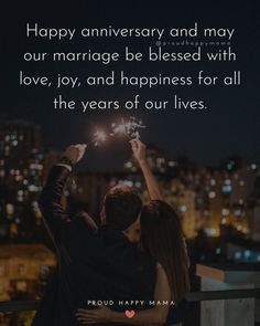 two people holding sparklers with the words happy anniversary and may our marriage be blessed with love, joy, and happiness for all the years of our lives