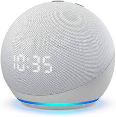 an alarm clock sitting on top of a bluetoothed speaker with the time displayed