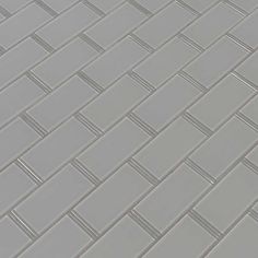 an image of a tile floor that looks like it is made out of grey bricks