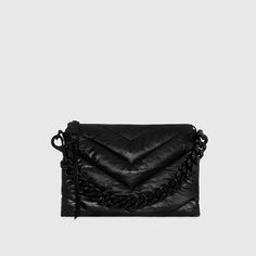 Sleek chevron quilting brings texture to our newest Edie. Made from nylon, this spacious crossbody bag gives you multiple styling options thanks to its woven chain top handle and removable shoulder strap. Style# CF24MNYXBO Nylon/Nappa PU Black Shellac Hardware 12. 375" W X 9" H X 1. 25" D Detachable Strap - Strap Drop 20. 25" Zipper Closure 1 Exterior Back Magnetic Snap Pocket 1 Interior Back Zip Pocket Imported The photos featuring a model are for size reference only. Actual color and material Black Shellac, Leather Outerwear, Chain Top, Woven Chain, Chevron Quilt, Large Shoulder Bags, Handbag Accessories, Belt Bag, Shoe Collection