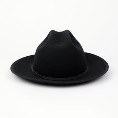 Our newest release is a hard wool style that also features a brand new crown shape. This Cattleman crown shape on our Field Fedora is a throwback to classic American headwear. A 2 3/4" flange up brim with brim binding. All leather is manufactured in a solar and wind powered facility that collects 27,300 tons of rainwater per year, and uses 50% natural light energy. Fit: Due to the stiff/firm nature of our hard wool, we recommend to check your head shape on our online fit guide below. The Field F Classic Brimmed Hat For Town, Classic Wide Brim Felt Hat For Town, Classic Felt Hat With Curved Brim For Town, Classic Adjustable Felt Hat For Town, Adjustable Classic Felt Hat For Town, Classic Flat Brim Felt Hat For Town, Classic Winter Felt Hat With Flat Crown, Classic Black Hat Band With Flat Crown, Classic Wool Felt Hat With Flat Crown