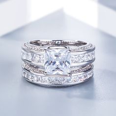 Princess Cut Sterling Silver Women's Ring Set White Princess Cut Promise Ring, White Sterling Silver Bridal Sets As Gift, Silver Bridal Sets Fine Jewelry As Gift, Luxury Silver Bridal Sets, Luxury White Gold Bridal Ring Set, White Princess Cut Rings In Fine Jewelry Style, White Fine Jewelry Bridal Ring Sets, White Princess Cut Ring With Vs Clarity, Dazzling White Stackable Rings