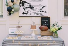 a football themed party with balloons and cake