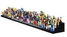 a large group of toy figurines sitting on top of a black shelf