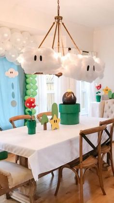 a dining room with balloons and decorations on the walls