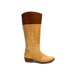 Vintage 1970s women's tan leather knee high western style riding boots. Features tan leather uppers with brown leather band at top of shaft, rounded toe, pull on style with no closures, rounded tops, and short wooden block heel. Very good vintage condition with wear at sides and toe. No branding stamp.   Heel to toe (inside shoe): 9.375 inches  Ball of foot (bottom of sole): 3.25 inches  Heel height: 1.5 inches  Shaft height: 13.5 inches  Circumference: 14 inches  Size 7 Western Brown Leather Knee-high Boots, Western Style Brown Leather Knee-high Boots, Wide Calf Leather Knee-high Boots For Ranch, Western Leather Knee-high Boots Medium Width, Fitted Brown Knee-high Boots For Ranch, Fitted Western Brown Knee-high Boots, Brown Knee-high Boots For Ranch In Fall, Vintage Beige Snip Toe Boots, Vintage Mid-calf Leather Boots