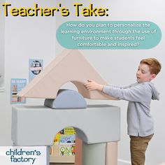 a young boy is playing with a toy house that he made out of cardboard and has a speech bubble above it