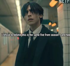 a man in a suit and tie standing next to a wall with the caption, i refuse to believe this is the same five from season 1 and two