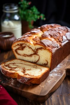 a loaf of cinnamon swirl bread on a cutting board