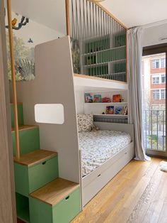 a bedroom with stairs leading up to the bed and storage boxes on the bottom floor