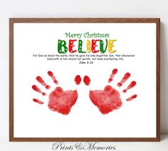 a christmas card with two hand prints on it