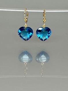 Gorgeous sparkly aquamarine heart earrings. The Faceted heart shape drops are flawless and have a beautiful clear sky blue color. The drops attached to secure 14k gold-filled lever backs. The earrings are elegant and have a lux look. A truly gorgeous pair of earrings. *AAA+ Faceted sky blue aquamarine hearts *The dimension of stones is about: 15mm *Metal: 14k gold filled *Earrings drop length (ear wires including the stones): 32 mm/ 1.3 inch Solid gold, 14K gold-filled, sterling silver, and gems Heart Cut Blue Topaz Birthstone Jewelry, Heart-shaped Blue Topaz Birthstone Jewelry, Blue Heart-cut Heart Earrings For Anniversary, Blue Heart Cut Earrings For Valentine's Day, Blue Heart Cut Earrings For Anniversary, Blue Heart-shaped Earrings For Anniversary, Elegant Blue Heart-shaped Earrings, Blue Jewelry With Matching Earrings For Valentine's Day, Blue Heart Cut Earrings For Gift