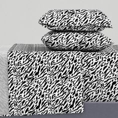 three zebra print sheets stacked on top of each other