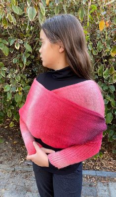 This versatile sweater scarf can be worn many ways, from a simple scarf, to a shrug, bolero, cross over shawl or wrap. The scarf measures 25cm in width and 240cm in length unstretched. It is modelled on an 11 year old 150cm child, with more than ample room for a large adult to wear comfortably. This item has been handknitted from a lace weight 70% wool/30% nylon mix. It is a fine knit, soft and squishy to wear, but hardy enough to withstand handwashing and getting thrown into the bottom of a bag Pink Shawl For Fall, One Size Wrap Shrug For Fall, Wrap Scarves For Fall, One Size Wrap Scarves For Fall, Fall Wrap Shawl Scarf, One Size Fall Wrap Scarves, One Size Fall Wrap Scarf, Sleeved Scarf, Versatile Sweater