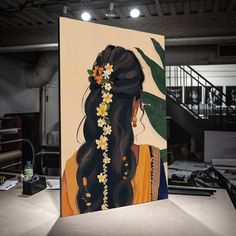 a painting of a woman with long hair and flowers in her hair is on display