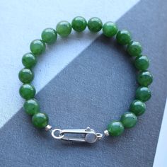 --- SPECIFICS --- 💚Materials: 100% Natural High End Green Nephrite Jade With s925 Sterling silver. Jade is from Canada, vivid green color with high quality. 💚Closure: the closure is made of 925 Sterling Silver.  💚Bracelet size: 6 -- 8 Inches 💚Bead Diameter: 8.0mm 10mm bead jade bracelet: https://gioiellohandcrafted.etsy.com/listing/1698765012/natural-vivid-green-jade-beaded 6mm bead jade bracelet: https://gioiellohandcrafted.etsy.com/listing/1673283337/natural-vivid-green-jade-beaded 4mm bea Minimalist Single Strand Beaded Bracelets With Round Beads, Minimalist Single Strand Beaded Bracelet, Minimalist Beaded Bracelets For Everyday, Minimalist Green Beaded Bracelet For Everyday, Green Minimalist Round Bead Bracelets, Minimalist Green Round Bead Bracelets, Minimalist Green Round Beads Bracelets, Minimalist Green Bracelet, Everyday Jade Beaded Bracelets With Round Beads